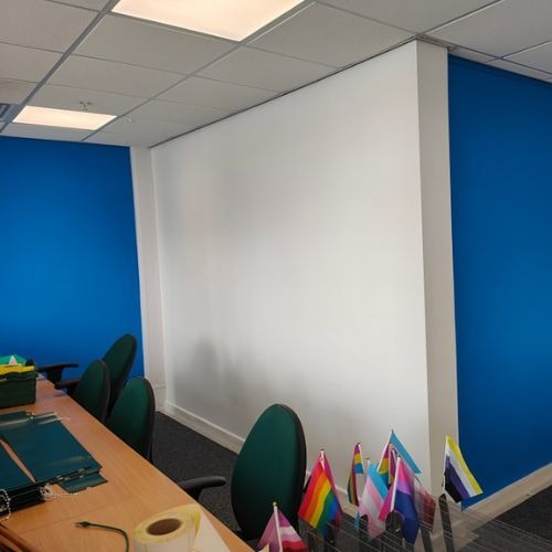 Office with bright blue feature walls decorated by G. Hull